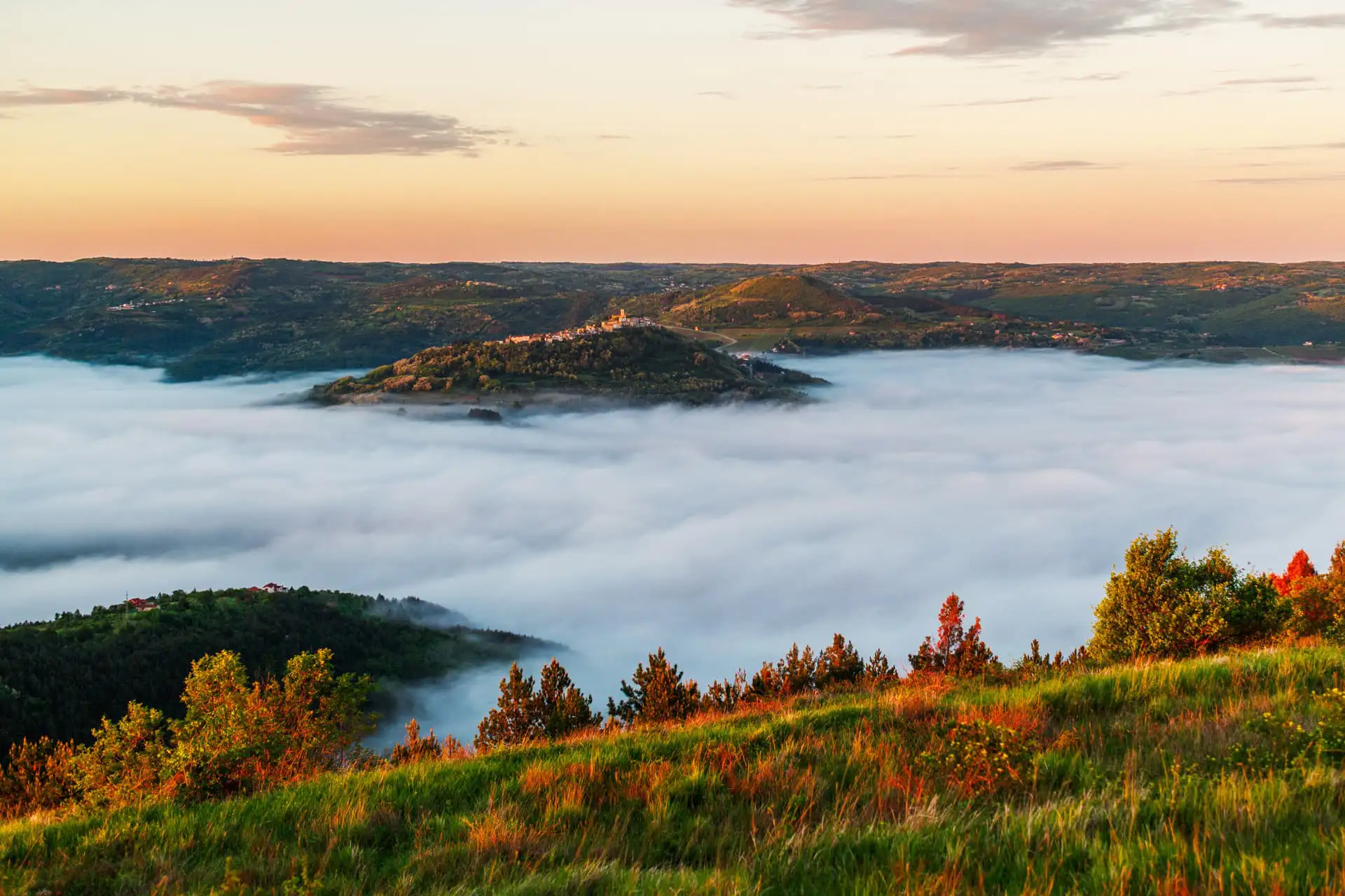 panoramic shot of motovun on the hilltop surrounded by the fog in the early autumn Luxury villa in Motovun