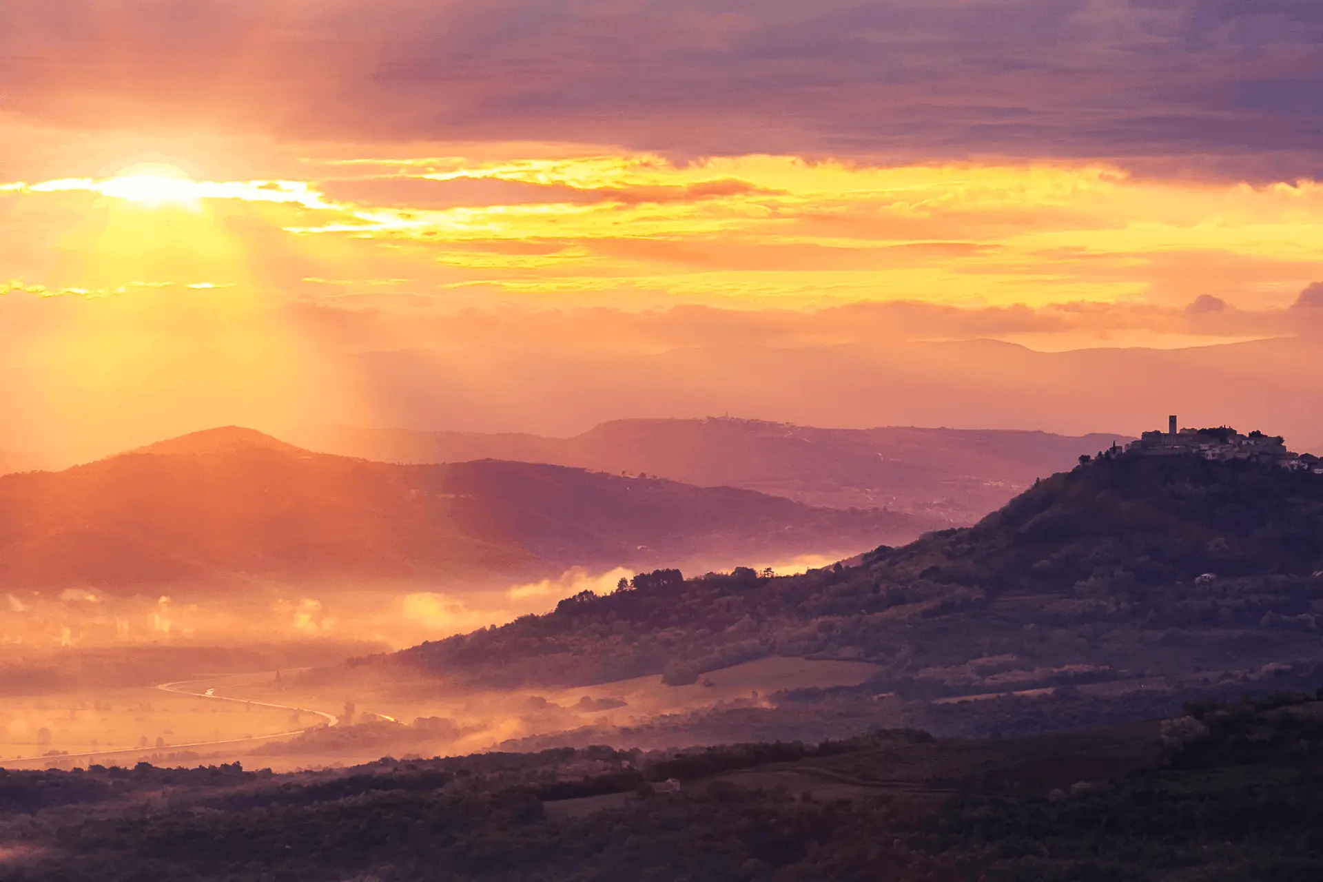 panoramic image of Motovun on top of the hill during the sunset