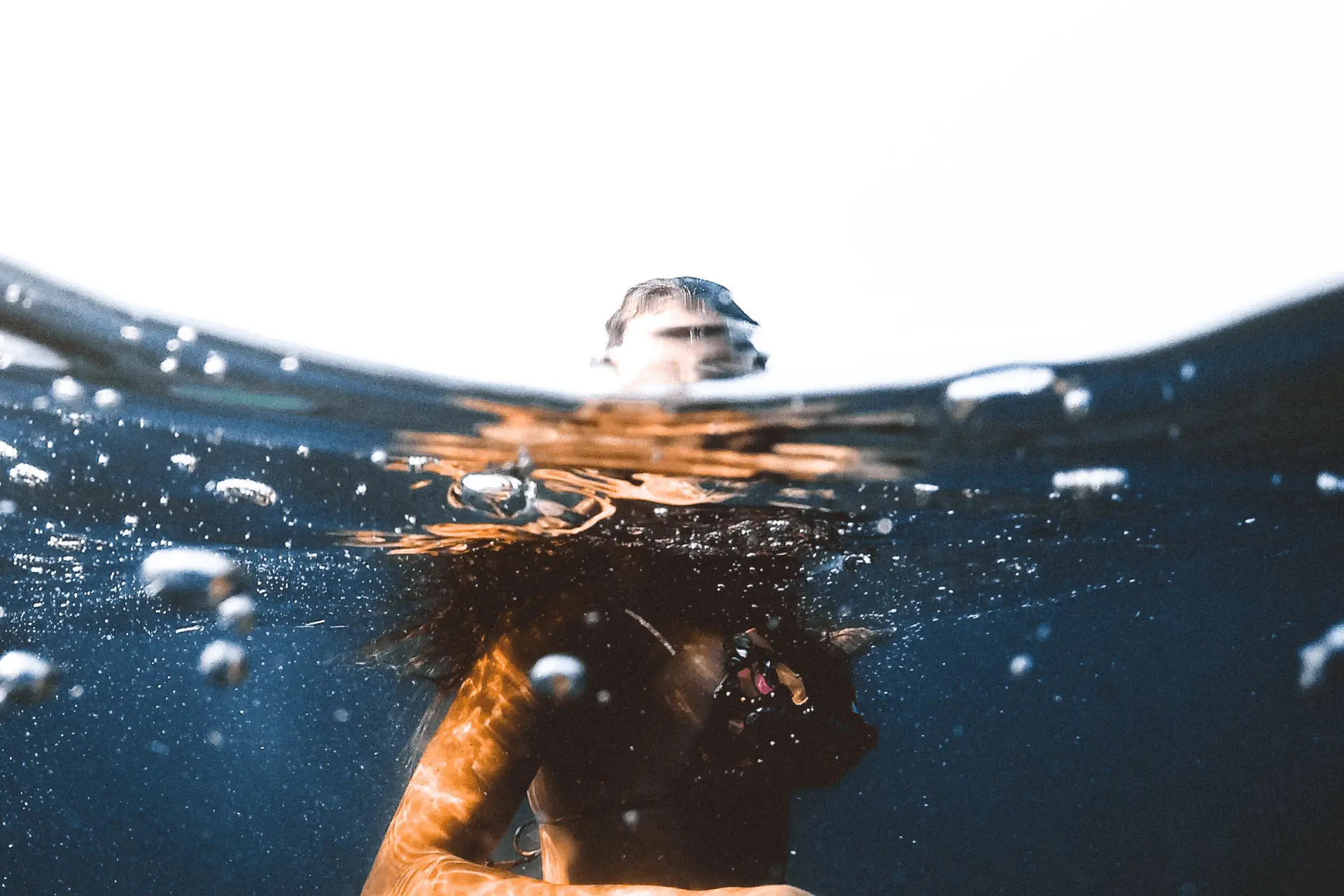 young woman swimming in the sea